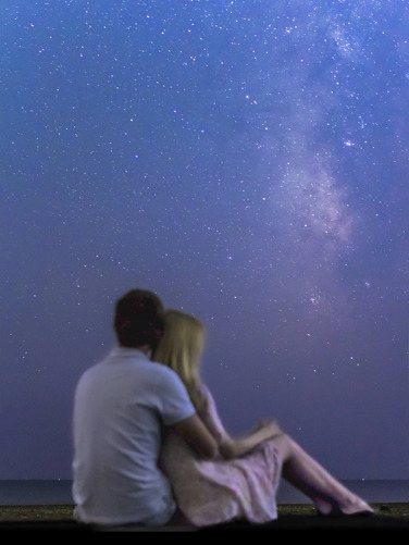 Couple stargazing at the Milky Way